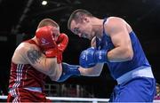 21 June 2015; Darren O'Neill, Ireland, right, exchanges punches with Raitis Sinkevics, Latvia, during their Men's Boxing Heavy 91kg Round of 16 bout. 2015 European Games, Crystal Hall, Baku, Azerbaijan. Picture credit: Stephen McCarthy / SPORTSFILE