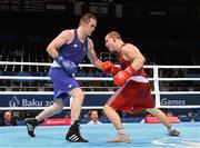 21 June 2015; Darren O'Neill, Ireland, left, exchanges punches with Raitis Sinkevics, Latvia, during their Men's Boxing Heavy 91kg Round of 16 bout. 2015 European Games, Crystal Hall, Baku, Azerbaijan. Picture credit: Stephen McCarthy / SPORTSFILE