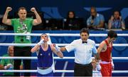 22 June 2015; Brendan Irvine, Ireland, is declared victorious over Salman Alizada, Azerbaijan, by referee Jones Kennedy Silva Do Rosario following their Men's Boxing Light Fly 49kg Quarter Final bout. 2015 European Games, Crystal Hall, Baku, Azerbaijan. Picture credit: Stephen McCarthy / SPORTSFILE