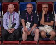 22 June 2015; Spectators, from left, EOC President and Olympic Council of Ireland President Pat Hickey, Paul McDermott, Irish Sports Council, Director of High Performance, NGB's & Communications, and John Treacy, CEO, Irish Sports Council, watch on as Ireland take on Finland in the Women's Badminton Doubles Group Stage match. 2015 European Games, Baku Sports Hall, Baku, Azerbaijan. Picture credit: Stephen McCarthy / SPORTSFILE