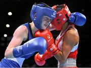 22 June 2015; Ceire Smith, Ireland, left, exchanges punches with Saiana Sagataeva, Russia, during their Women's Boxing Fly 51kg Quarter Final bout. 2015 European Games, Crystal Hall, Baku, Azerbaijan. Picture credit: Stephen McCarthy / SPORTSFILE