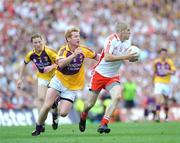 31 August 2008; Kevin Hughes, Tyrone, in action against Eric Bradley, Wexford. GAA Football All-Ireland Senior Championship Semi-Final, Tyrone v Wexford, Croke Park, Dublin. Picture credit: Pat Murphy / SPORTSFILE