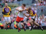 31 August 2008; Tommy McGuigan, Tyrone, is tackled by Philip Wallace, Wexford. GAA Football All-Ireland Senior Championship Semi-Final, Tyrone v Wexford, Croke Park, Dublin. Picture credit: Brendan Moran / SPORTSFILE