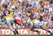 31 August 2008; Tommy McGuigan, Tyrone, in action against David Walsh, 2, and Giaran Gourley, Wexford. GAA Football All-Ireland Senior Championship Semi-Final, Tyrone v Wexford, Croke Park, Dublin. Picture credit: David Maher / SPORTSFILE