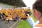 31 August 2008; A fan takes a picture on her mobile phone of the winning Kilkenny team. All-Ireland Minor A Championship Final, Clare v Kilkenny, Geraldine Park, Athy, Co. Kildare. Photo by Sportsfile