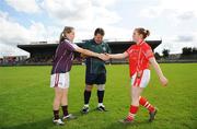31 August 2008; Galway captain Tracey Leonard greets Cork captain Denise Cronin in the company of referee Sean McIntyre. All-Ireland Ladies U16 A Football Championship Final, Cork v Galway, McDonagh Park, Nenagh, Co. Tipperary. Picture credit: Brian Lawless / SPORTSFILE