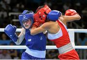 22 June 2015; Ceire Smith, Ireland, left, exchanges punches with Saiana Sagataeva, Russia, during their Women's Boxing Fly 51kg Quarter Final bout. 2015 European Games, Crystal Hall, Baku, Azerbaijan. Picture credit: Stephen McCarthy / SPORTSFILE