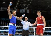 22 June 2015; Joe Joyce, Great Britain, is declared victorious over Mantas Valavicius, Lithuania, by referee Vladyslav Malyshev following their Men's Boxing Super Heavy +91kg Quater Final bout. 2015 European Games, Crystal Hall, Baku, Azerbaijan. Picture credit: Stephen McCarthy / SPORTSFILE