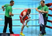 23 June 2015; Dean Walsh, Ireland, accompanied by coaches Billy Walsh, left, and Zaur Antia leaves the ring after being defeated by Sopa Kastriot, Germany, following their Men's Boxing Light Welter 64kg Quarter Final bout. 2015 European Games, Crystal Hall, Baku, Azerbaijan. Picture credit: Stephen McCarthy / SPORTSFILE