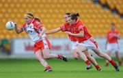 6 September 2008; Gemma Begley, Tyrone, in action against Geraldine O'Flynn and Briege Corkery, Cork. TG4 All-Ireland Ladies Senior Football Championship Semi-Final - Cork v Tyrone, O'Connor Park, Tullamore, Co. Offaly. Picture credit: Brendan Moran / SPORTSFILE