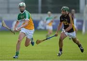 24 June 2015; Matthew Maloney, Offaly, in action against Conor Devitt, Wexford. Bord Gáis Energy Leinster GAA Hurling U21 Championship, Semi-Final, Offaly v Wexford. O'Connor Park, Tullamore, Co. Offaly. Picture credit: Piaras Ó Mídheach / SPORTSFILE