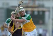 24 June 2015; Cathal Mahon, Offaly, in action against Conor Devitt, Wexford. Bord Gáis Energy Leinster GAA Hurling U21 Championship, Semi-Final, Offaly v Wexford. O'Connor Park, Tullamore, Co. Offaly. Picture credit: Piaras Ó Mídheach / SPORTSFILE