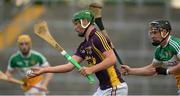 24 June 2015; Conor McDonald, Wexford, in action against Cillian Kelly, Offaly. Bord Gáis Energy Leinster GAA Hurling U21 Championship, Semi-Final, Offaly v Wexford. O'Connor Park, Tullamore, Co. Offaly. Picture credit: Piaras Ó Mídheach / SPORTSFILE