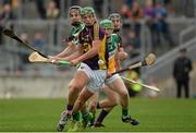24 June 2015; Conor McDonald, Wexford, in action against Cillian Kiely, Offaly. Bord Gáis Energy Leinster GAA Hurling U21 Championship, Semi-Final, Offaly v Wexford. O'Connor Park, Tullamore, Co. Offaly. Picture credit: Piaras Ó Mídheach / SPORTSFILE
