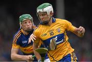 25 June 2015; Aaron Shanagher, Clare, in action against Brian McGrath, Tipperary. 2015 Electric Ireland Munster GAA Hurling Minor Championship, Clare v Tipperary. Semple Stadium, Thurles, Co. Tipperary. Picture credit: Ray McManus / SPORTSFILE