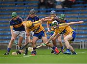 25 June 2015; Brian McGrath, 6, Kevin Hassett, 18, Tipperary, in action against Jason McCarthy, 12, and Conor O'Halloran, 15, Clare. 2015 Electric Ireland Munster GAA Hurling Minor Championship, Clare v Tipperary. Semple Stadium, Thurles, Co. Tipperary. Picture credit: Ray McManus / SPORTSFILE