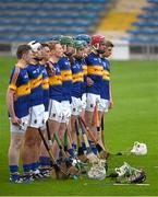 25 June 2015; The Tipperary team stand together during a minute's silence in honour of the late Jimmy Doyle. 2015 Electric Ireland Munster GAA Hurling Minor Championship, Clare v Tipperary. Semple Stadium, Thurles, Co. Tipperary. Picture credit: Ray McManus / SPORTSFILE