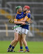 25 June 2015; Tipperary players Brian McGrath, left, and Rudhan Mulrooney celebrate after the game. 2015 Electric Ireland Munster GAA Hurling Minor Championship, Clare v Tipperary. Semple Stadium, Thurles, Co. Tipperary. Picture credit: Ray McManus / SPORTSFILE