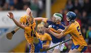 25 June 2015; Martin Daly, left, and Darren Chaplin, Clare, in action against Emmet Moloney, Tipperary. 2015 Electric Ireland Munster GAA Hurling Minor Championship, Clare v Tipperary. Semple Stadium, Thurles, Co. Tipperary. Picture credit: Ray McManus / SPORTSFILE