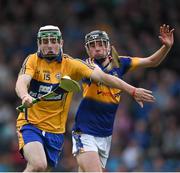 25 June 2015; Conor O'Halloran, Clare, in action against Enda Heffernan, Tipperary. 2015 Electric Ireland Munster GAA Hurling Minor Championship, Clare v Tipperary. Semple Stadium, Thurles, Co. Tipperary. Picture credit: Ray McManus / SPORTSFILE