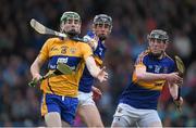 25 June 2015; Conor O'Halloran, Clare, in action against Enda Heffernan, centre, and Kevin Hassett, Tipperary. 2015 Electric Ireland Munster GAA Hurling Minor Championship, Clare v Tipperary. Semple Stadium, Thurles, Co. Tipperary. Picture credit: Ray McManus / SPORTSFILE