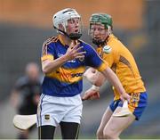 25 June 2015; Tommy Lowrey, Tipperary, in action against Darragh Peters, Clare. 2015 Electric Ireland Munster GAA Hurling Minor Championship, Clare v Tipperary. Semple Stadium, Thurles, Co. Tipperary. Picture credit: Ray McManus / SPORTSFILE