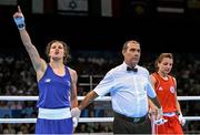 26 June 2015; Katie Taylor, Ireland, in announced victorious over Yana Alekseevna, Azerbaijan, by referee Jose Ignacio Del Puerto Trueba, following their Women's Boxing Light 60kg Semi-Final bout. 2015 European Games, Crystal Hall, Baku, Azerbaijan. Picture credit: Stephen McCarthy / SPORTSFILE