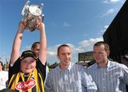 8 September 2008; Kilkenny's James 'Cha' Fitzpatrick and Michael Kavanagh, right, look on as Fionn McLoughlin, aged 13, From Kilkenny, lifts the Liam MacCarthy Cup during a visit to Our Lady's Hospital for Sick Chidren in Crumlin. Crumlin, Co. Dublin. Picture credit: Pat Murphy / SPORTSFILE