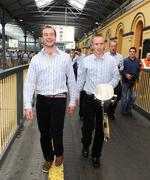 8 September 2008; Kilkenny's JJ Delaney, left, and James 'Cha' Fitzpatrick, holding the Liam MacCarthy Cup, arrive at the train station prior to the victorious Kilkenny team's departure to Kilkenny for their homecoming. Heuston Station, Dublin. Picture credit; Pat Murphy / SPORTSFILE