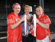 31 August 2008; Uachtaran Cumann Peil Gael na mBan Geraldine Giles presents Cork co-captains Denise Cronin, right, and Ciara Sherlock, with the cup. All-Ireland Ladies U16 A Football Championship Final, Cork v Galway, McDonagh Park, Nenagh, Co. Tipperary. Picture credit: Brian Lawless / SPORTSFILE
