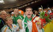 10 September 2008; Ireland's Michael McKillop, from Glengormley, Co. Antrim, celebrates with the Gold medal watched by, from left, Chef de Mission, Jimmy, Byrne, Killester, Dublin, Camp Training Manager Nancy Chillingworth, Mornington, Meath, and Paralympic Performance Director Liam Harbison, Termonfeckin, Louth, after he won the Men's 800m - T37 in a World Record Time of 1:59.39. Beijing Paralympic Games 2008, Men's 800m - T37, National Stadium, Olympic Green, Beijing, China. Picture credit: Brian Lawless / SPORTSFILE