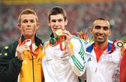 10 September 2008; Ireland's Michael McKillop, from Glengormley, Co. Antrim, celebrates with his Gold medal after winning the Men's 800m - T37 in a World Record Time of 1:59.39, alongside Silver medalist Brad Scott, Australia, and Bronze medalist, Djamel Mastouri, France. Beijing Paralympic Games 2008, Men's 800m - T37, National Stadium, Olympic Green, Beijing, China. Picture credit: Brian Lawless / SPORTSFILE