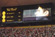 10 September 2008; Ireland's Michael McKillop, from Glengormley, Co. Antrim, is shown on the scoreboard during the National Anthem after winning the Gold medal in the Men's 800m - T37 in a World Record Time of 1:59.39. Beijing Paralympic Games 2008, Men's 800m - T37, National Stadium, Olympic Green, Beijing, China. Picture credit: Brian Lawless / SPORTSFILE