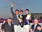 26 June 2015; Joint winners share the top step of the podium, left to right, Gabriel Corless, Jason Higgins and Liam O'Meara celebrate after The Devenish Puissance during the Final Leg of Jumping In The City. Front row: Prof. Patrick G. Wall, Horse Sport Ireland Chairman and Morgan Sheehy from Devenish Nutrition. Shelbourne Park Greyhound Stadium, Ringsend, Dublin. Picture credit: Cody Glenn / SPORTSFILE