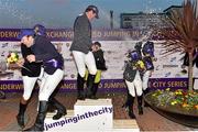 26 June 2015; Winners from the evening's three events including Gabriel Corless, top, and Liam O'Meara, left, celebrate with champagne during the Final Leg of Jumping In The City. Shelbourne Park Greyhound Stadium, Ringsend, Dublin. Picture credit: Cody Glenn / SPORTSFILE