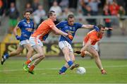 27 June 2015; John McGrath, Wicklow, scores his side's first goal despite the efforts of Andy Mallon and Brendan Donaghy, right, Armagh. GAA Football All-Ireland Senior Championship, Round 1B, Armagh v Wicklow. Athletic Grounds, Armagh. Picture credit: Piaras Ó Mídheach / SPORTSFILE