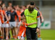 27 June 2015; Armagh manager Kieran McGeeney is congratulated by his son Cian, age 7, after the game. GAA Football All-Ireland Senior Championship, Round 1B, Armagh v Wicklow. Athletic Grounds, Armagh. Picture credit: Piaras Ó Mídheach / SPORTSFILE