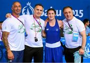 27 June 2015; Katie Taylor, Ireland, with coaches, from left, Pete Taylor, Billy Walsh and Zaur Antia after defeating Estelle Mossely, France, following their Women's Boxing Light 60kg Final bout. 2015 European Games, Crystal Hall, Baku, Azerbaijan. Picture credit: Stephen McCarthy / SPORTSFILE