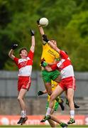 27 June 2015; Michael Carroll, Donegal, in action against Patrick Coney, left, and Patrick Kearney, Derry.  Electric Ireland Ulster GAA Football Minor Championship, Semi Final, Derry v Donegal. St Tiernach's Park, Clones, Co. Monaghan. Picture credit: Ramsey Cardy / SPORTSFILE
