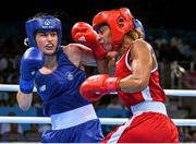 27 June 2015; Katie Taylor, Ireland, left, exchanges punches with Estelle Mossely, France, during their Women's Boxing Light 60kg Final bout. 2015 European Games, Crystal Hall, Baku, Azerbaijan. Picture credit: Stephen McCarthy / SPORTSFILE