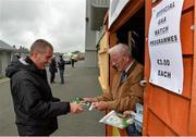 27 June 2015; Programme seller Gay Stafford with Michael McKeown from Moira, Co. Down, before the game. GAA Football All-Ireland Senior Championship, Round 1B, Wexford v Down. Innovate Wexford Park, Wexford. Picture credit: Matt Browne / SPORTSFILE