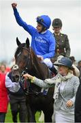 27 June 2015; Jockey William Buick on Jack Hobbs after winning the Dubai Duty Free Irish Derby. Also pictured Rachel Hood, co-owner. Curragh Derby Festival. The Curragh, Co. Kildare. Picture credit: Cody Glenn / SPORTSFILE