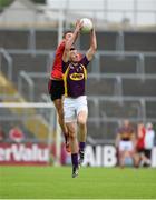 27 June 2015; Syl Byrne, Wexford, in action against Caolan Mooney, Down. GAA Football All-Ireland Senior Championship, Round 1B, Wexford v Down. Innovate Wexford Park, Wexford. Picture credit: Matt Browne / SPORTSFILE