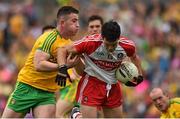 27 June 2015; Danny Heavron, Derry, is tackled by Patrick McBrearty, Donegal. Ulster GAA Football Senior Championship, Semi-Final, Derry v Donegal. St Tiernach's Park, Clones, Co. Monaghan. Picture credit: Ramsey Cardy / SPORTSFILE