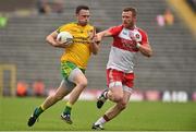 27 June 2015; Martin McElhinney, Donegal, in action against Fergal Doherty, Derry. Ulster GAA Football Senior Championship, Semi-Final, Derry v Donegal. St Tiernach's Park, Clones, Co. Monaghan. Picture credit: Ramsey Cardy / SPORTSFILE