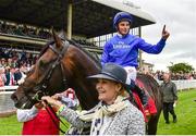 27 June 2015; Jockey William Buick celebrates on Jack Hobbs after winning the Dubai Duty Free Irish Derby. Also pictured is Rachel Hood, part owner. Curragh Derby Festival. The Curragh, Co. Kildare. Picture credit: Cody Glenn / SPORTSFILE