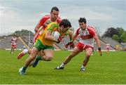 27 June 2015; Ryan McHugh, Donegal, in action against Caolan O'Boyle, left, and Danny Heavron, Derry. Ulster GAA Football Senior Championship, Semi-Final, Derry v Donegal. St Tiernach's Park, Clones, Co. Monaghan. Picture credit: Ramsey Cardy / SPORTSFILE