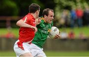27 June 2015; Fergal Clancy, Leitrim, in action against Adrian Reid, Louth. GAA Football All-Ireland Senior Championship, Round 1B, Louth v Leitrim. County Grounds, Drogheda, Co. Louth. Picture credit: Piaras Ó Mídheach / SPORTSFILE
