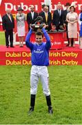 27 June 2015; Jockey William Buick raises his trophy after riding Jack Hobbs to victory in the Dubai Duty Free Irish Derby. Curragh Derby Festival. The Curragh, Co. Kildare. Picture credit: Cody Glenn / SPORTSFILE