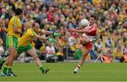 27 June 2015; Kevin Johnston, Derry, in action against Colm McFadden, Donegal. Ulster GAA Football Senior Championship, Semi-Final, Derry v Donegal. St Tiernach's Park, Clones, Co. Monaghan. Picture credit: Oliver McVeigh / SPORTSFILE
